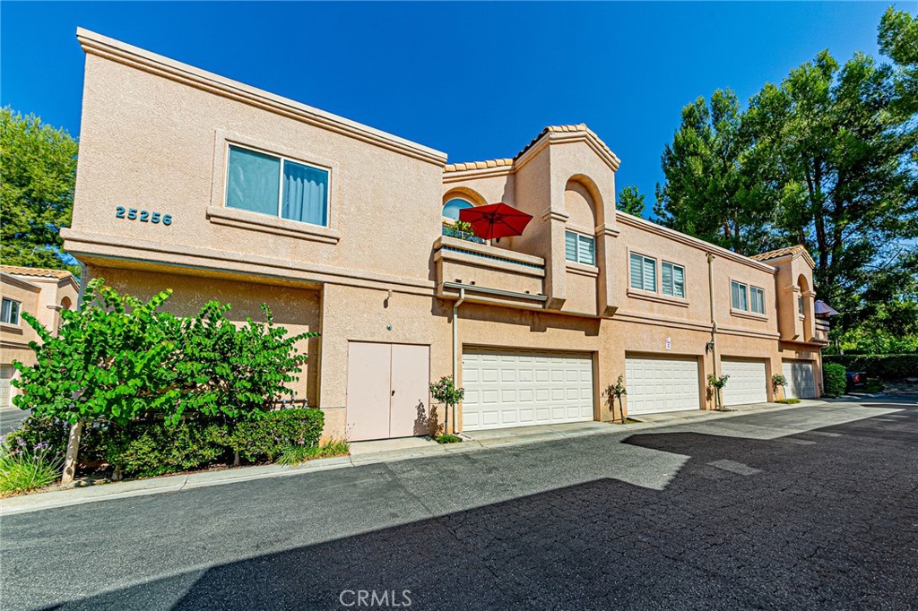 Price to Sell! Immaculate Diamond Head Townhome in Stevenson Ranch. Beautifully maintained 2 bed, 2 bath townhome in the highly desirable Diamond Head community of Stevenson Ranch. This bright and airy home features a spacious open floor plan with vaulted ceilings, laminate hardwood flooring throughout, recessed lighting, and custom window shades. The living room offers a cozy fireplace and opens to a private balcony, perfect for relaxing or entertaining. The upgraded kitchen includes quartz countertops, stainless steel sink and appliances, and sleek white cabinetry. The primary suite offers dual mirrored closets and an en-suite full bathroom. Additional highlights include in-unit laundry, an attached side-by-side 2-car garage with direct access, and close proximity to the community pool, playground, and greenbelt. Conveniently located near the freeway, shopping, dining, and top-rated schools. A rare opportunity—this gem won’t last long! Beautifully Upgraded Townhome in Prime Stevenson Ranch Location. This gem won't last long!