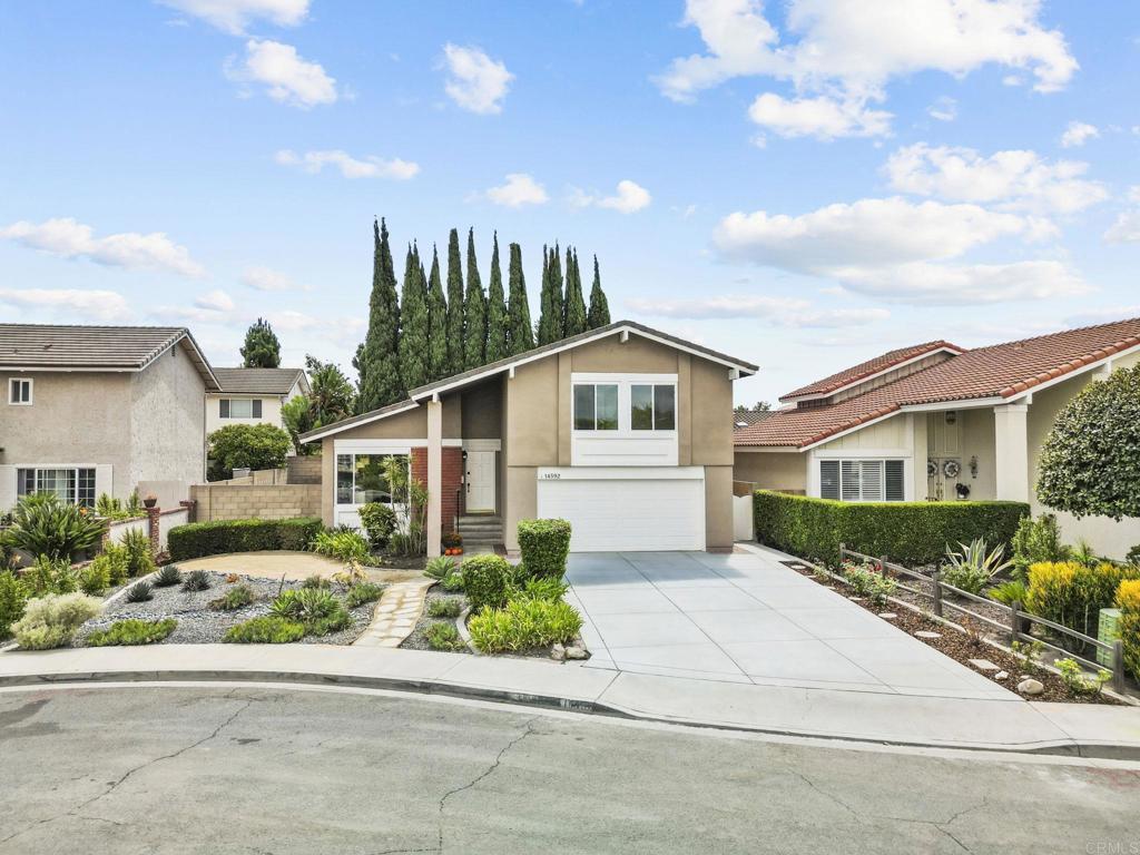 Welcome to this beautifully updated 4-bedroom, 2.5-bath home nestled on a quiet cul-de-sac in the highly sought-after College Park community of Irvine. Offering 1897 s.f. of living space on a 5251 s.f. lot, this home combines comfort, style and a prime location. Step inside to fresh interior paint, brand-new carpet, and refinished hardwood flooring. The kitchen features new quartz countertops, stainless appliances, and a new stove/oven and microwave. The adjoining dining area opens through French doors to a beautiful deck-perfect for outdoor dining, entertaining or simply unwinding. Enjoy the large family room with fireplace and built-in wet bar, creating the ideal space for relaxing or hosting guests with slider access to the backyard. Upstairs, the primary suite features a walk-in closet and newly renovated bathroom with quartz countertop, new flooring, and a modern shower. Three additional bedrooms include mirrored closet doors, and all four bedrooms are equipped with ceiling fans for year-round comfort. The hall bath has also been updated with a new tiled tub, quartz vanity top and flooring. Additional features include a new cement driveway, Upgraded 200-amp electrical panel, LOW HOA and LOW TAXES! Located within walking distance to College Park Elementary, community pool, parks and more-this move-in ready home offers comfort, charm and a strong sense of community. A MUST SEE!