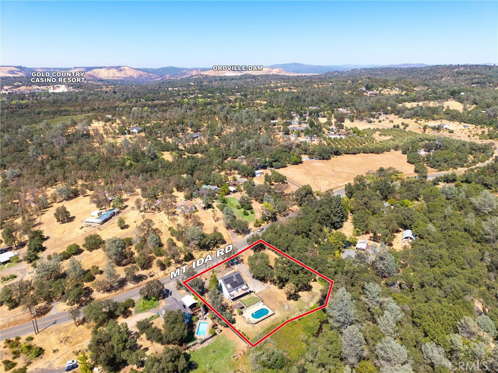 Don't miss your opportunity to own this extremely rare tri-level home. This spacious remodeled home boast 2010 SQFT of living space, and sits on 0.88 acres. The exterior features multiple sets of solar panels; with one set being owned and another leased. The land features a fully fenced area that features several raised garden beds and a chicken coop. Directly behind the home you will find a beautiful sparkling in ground Vinyl swimming pool that reaches 9 feet deep, and is fully fenced. This lot also features multiple fruit trees, apple, pomegranate, grapes, and peach. Let's not forget about the brand new composite deck with fully reinforced pillars. Sit on your beautiful deck and enjoy your summer days while your friends and family go for a swim. As you enter the home you will be greeted with brand new granite counter tops, newer appliances, original hardwood flooring, new ceiling fans, and a spacious walk-in pantry. The living room also features original hardwood flooring and a pallet stove. The middle level features two bedrooms; the master bedroom features original hardwood flooring, spacious closet, and a re modeled bathroom with new plumbing. The dual sink features quartz counter tops, and the walk in shower that was redone by Miracle Method Surface Re-finishing. Directly across from the master bedroom is an additional bedroom with easy access to the living area. Furthermore, as you walk up stairs to the top level you will find an additional master bedroom with another bathroom; that was redone by Miracle Method Surface Re-finishing. Across the way is an additional bedroom as well. Additionally, as you walk down stairs to the lower level you will find a bonus room that can also be used as a 5th bedroom, office, or exercise room. In addition to the left of the bonus room you will find an area that can be used as storage or use your imagination as you see fit. Call or text today and make this your next home.