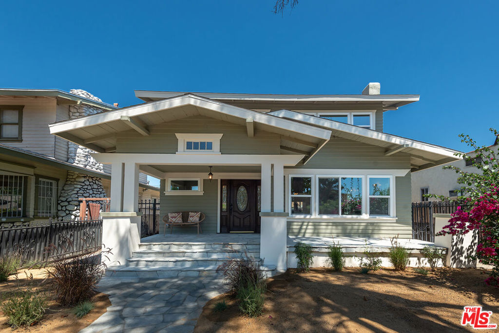 Live in style in this fully renovated 4-bedroom, 2-bath, 2,026 sq. ft. Craftsman in vibrant Exposition Park. Enjoy modern upgrades like new AC, tankless heater, stainless steel appliances, high-speed Wi-Fi, in-unit washer/dryer, imported tiles, and premium finishes, all paired with classic charm. On a tree-lined street, enter via an iron-gated yard to a flagstone porch, perfect for breezy evenings. Inside, a restored staircase leads to a bright open floorplan. The chef's kitchen offers top appliances, a breakfast nook, and ample storage, flowing into the laundry area. The dining room, with original wood paneling, is great for gatherings. Spacious bedrooms feature walk-in closets, and bathrooms boast Kohler fixtures and artisan tiles. French doors open to a private, gated backyard with greenery and a 2-car parking space. In a friendly community, steps from USC, Exposition Park's Coliseum, museums, the Metro E Line's Western/Expo station, offers quick commutes to Downtown LA's Grand Central Market, Santa Monica's Pier, or LAX. Near The Grove, LACMA, and major freeways, you're perfectly positioned to enjoy LA's vibrant dining, shopping, and cultural scenes. Schedule a viewing today to lease this Craftsman gem - your perfect blend of heritage and modern living!