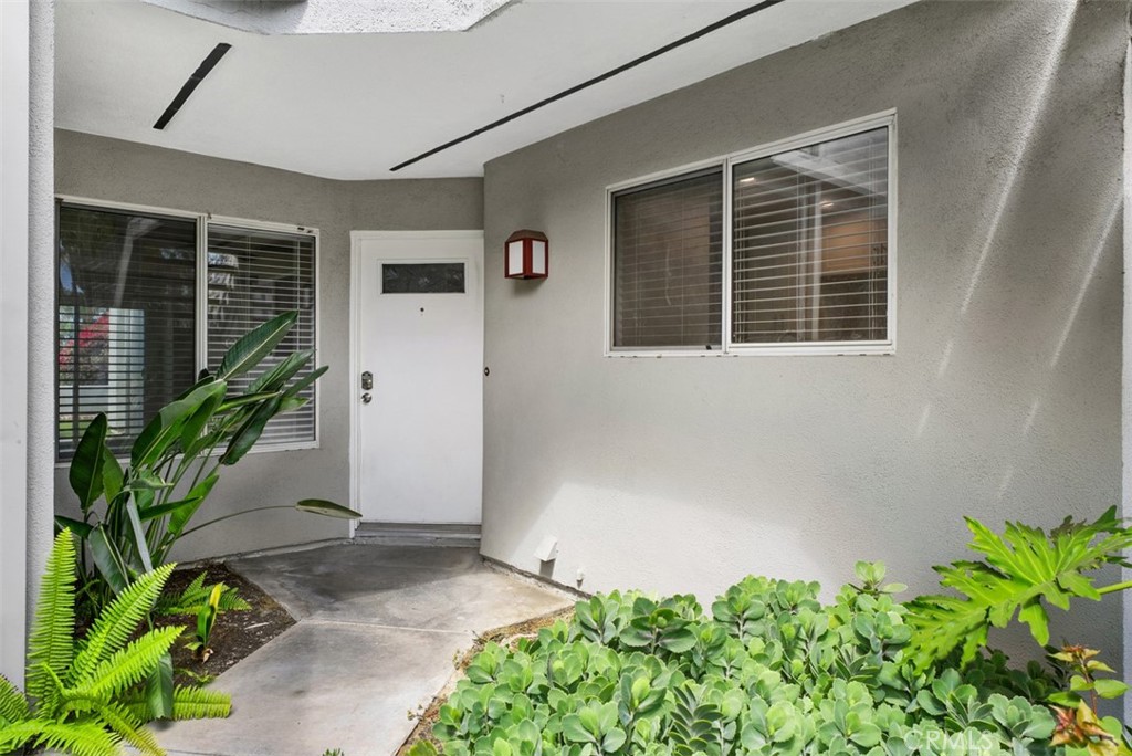 Welcome to your newly renovated 2 bed, 1.25 bath condo in the heart of Mission Viejo. This home blends modern updates with everyday convenience. Inside, you'll find brand new beautiful wood-like floors, new kitchen counters, fresh finishes and an open layout designed for comfort. The updated kitchen flows into the living area, and includes a stackable washer/dryer tucked neatly inside a kitchen closet for easy use. Step out into your private backyard and take in both sunrise and sunset views -- the perfect setting for morning coffee or evening relaxation. The community pool is just steps away, giving you a resort-style feel right outside your door. Parking is a breeze with YOUR OWN attached, direct-access garage plus plenty of guest and undesignated spaces within the complex. Location couldn't be better--across from Home Depot and Crown Valley Market, just down the street from The Shops at Mission Viejo. Close to lots of dining, shopping, and freeways. Whether you're a professional, small family or anyone looking for a fresh start, this home offers the lifestyle Mission Viejo is known for.
