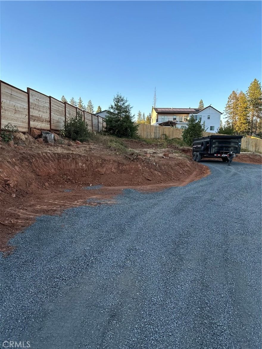 This .69-acre lot is privately situated down a flag-lot driveway in lower Paradise, just off Pentz Road. The previous home on the property was approximately 2,013 square feet, offering a great footprint for rebuilding. The seller has completed several improvements, including a new septic system and leach field, adding tremendous value and convenience for future construction. This is an excellent opportunity for your next home or investment project.