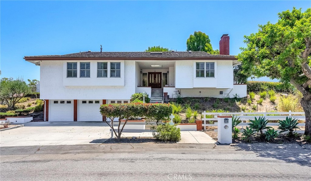 Welcome to this attractive single-story home in the highly sought-after Rolling Hills Estates, located across the street from the prestigious Rolling Hills Country Club. This property also boasts a permit-pending, approx. 1,000 sqft ADU with 2 bedrooms & 1 bathroom.
Offering over 2,900 sqft of living space, the home features 3 spacious bedrooms & 3 beautifully designed bathrooms, all set on a generous, approx. 24,000 sqft lot. The kitchen is a true standout, featuring a sleek remodel that includes a Wolf range, a Sub-Zero refrig/freezer, a Bosch dishwasher, & a large walk-in pantry—perfect for culinary enthusiasts. Throughout the home, you'll find Pella casement windows & doors, along with multiple skylights, ensuring an abundance of natural light. A newly installed air conditioning & heating system, along with ductwork, is available to provide comfort on those hot summer & cold winter days. A new electric vehicle charger has been recently installed for electric car owners.
A sizeable primary bedroom & bath offer ample storage and a fantastic view of the attractive backyard.
The bathrooms are equally impressive, showcasing stunning tile work, marble countertops, & an egg-shaped freestanding tub in the primary bath.
With three distinct gathering areas—the family room, featuring an impressive fireplace; the living room, with a vaulted ceiling; & the dining room, with large glass doors—this home offers ample space for both intimate gatherings & large events. Additionally, the home features a spacious laundry room that can easily be transformed into a versatile space for various functions.
There's also ample room for potential expansion, with the large front yard offering the possibility of a circular driveway (BTV).
Step outside & experience the tranquility of the thoughtfully designed landscaping, ideal for relaxation & outdoor enjoyment. The backyard is a true oasis, featuring 2 pergolas & horse facilities that border trails, and an array of fruit trees, including tangerines, loquats, baby guavas, macadamia nuts, & persimmons. It is also large enough to host gatherings, with plenty of room for a party or to practice your putting skills. From here, take in the stunning city lights & golf course views, while the enclosed yard offers a safe, free-roaming space for pets.
Enjoy the best of both worlds—country living with easy access to the city. The home is just minutes from restaurants, schools, shopping, the beach, and major freeways.