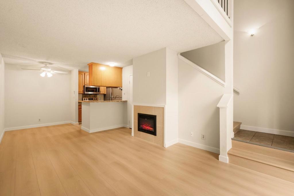 Welcome to 385 Mandarin Drive #11, a rare and beautifully updated 2-story townhouse that feels more like a private home. With its own separate entrance from the street, this bright unit offers the perfect blend of comfort, style, and privacy. The main level features an open plan offering a remodeled kitchen with granite countertops, sleek stainless-steel appliances, and rich beechwood cabinets. The living room offers a cozy electric fireplace and brand-new flooring that flows seamlessly throughout the space. The charming dining area provides the perfect setting for everyday meals or intimate gatherings. Enjoy your morning coffee at the breakfast bar or step outside to relax with a book read on your own private deeded patio. Upstairs, you'll find a spacious loft-style bedroom with large picture windows that frame the surrounding landscape. The updated bathroom includes a shower over tub and an oversized walk-in closet w/ built-in organizer. Additional conveniences include a deeded parking space and private storage cabinet. There is an abundance of amenities, including Gym, Clubhouse, Tennis/Basketball Courts and more! Ideally located near Serramonte Shopping Center and Gellert Market Place, offering easy access shopping, dining, a variety of everyday services and freeway!