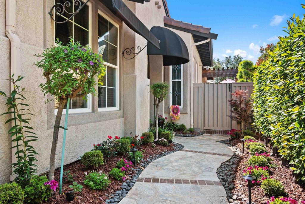 Single-Story Serenity with Spectacular Canyon Views in Rancho Carrillo - Welcome to 6130 Paseo Monona - your private slice of paradise in one of Carlsbad’s most sought-after communities. This beautifully appointed single-story home offers the perfect blend of elegance, comfort, and California lifestyle. Featuring 3 spacious bedrooms plus a versatile optional 4th bedroom or office, this home is ideal for those seeking single-level luxury. Additional features include Solar panels, Solatube Skylights, crown molding, and custom arched doorways. Enter inside the custom African Mahogany crafted front door to discover a warm and inviting spacious entry and formal dining room. The heart of the home flows effortlessly from the bright breakfast nook to a cozy living room with seamless access to the backyard, creating the ultimate indoor-outdoor experience. Enjoy al fresco meals on the patio with direct BBQ access, all while soaking in panoramic canyon views and rolling hill vistas that feel like an escape into nature. The primary bedroom suite is a true retreat, featuring serene views, generous closet space, and a spa-inspired bathroom. Every inch of the meticulously landscaped yard has been lovingly cared for, offering color, privacy, and tranquility year-round. Nestled among pristine nature trails, Rancho Carrillo also boasts a premier swim center and a vibrant community atmosphere. With top-rated schools, shopping, and beaches just minutes away, this home offers the very best of Carlsbad living. Don’t miss this rare opportunity to own a canyon-view single-story home in one of North County’s most desirable neighborhoods.