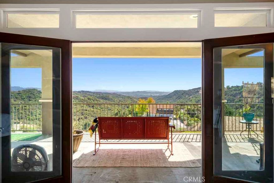 One of the few premier custom view properties with extreme privacy in the Saddleback Valley situated on almost 3 acres. This is a property that is prime for a large expansion, which is very rare in Trabuco Canyon. Wide open floor plan with fantastic views from every room in the house for miles in all directions! When you walk into the great room with kitchen, family, living & dining areas combined, with a massive fireplace as the focal point, you will instantly feel at home. Upstairs is a huge primary bedroom with fireplace, luxurious primary bath suite, two walk-in closets and a large office. French doors lead out of the primary bedroom onto a balcony that extends the length of the house. Just imagine waking up every morning and sitting on your balcony with your coffee and admiring the fantastic views. Large flat backyard area that could be transformed into an entertaining backyard. There are plans for an extra 1000 sf on the second level above the garage. The oversized 2-car garage currently has a bedroom and steam shower that connects to the garage, perfect place for parent, adult child or long-term guest. There is also a option of a downstairs bedroom in the original plan for the house when first built. Please take a look at the virtual tour to see if this could be a home for you! Keep in mind that this is only minutes away to shopping and dining but is like living in Fallbrook!