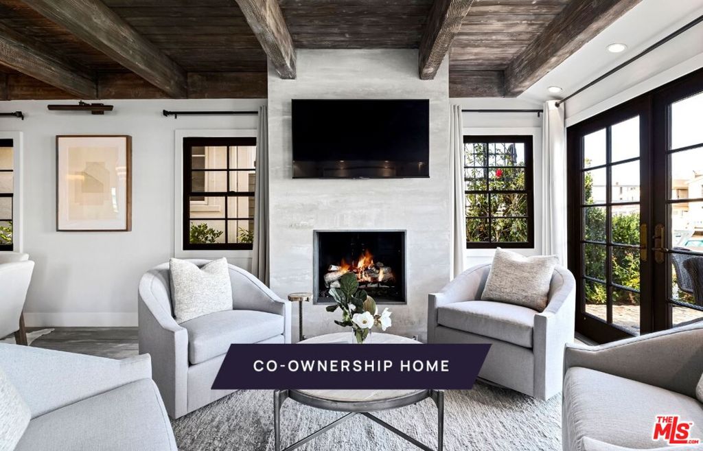 New Co-Ownership Opportunity: Own one-eighth of this turnkey home, professionally managed by Pacaso. Breezy days await you at Balboa Promenade, a beautifully designed, charming home perched along Balboa Island's main walking route. Step out on your patio for epic people-watching and enjoy an easy 1.5-mile loop around the canal, or take a Duffy for a ride out and see the iconic surf spot, The Wedge. Plus, the home is only minutes away from Newport Beach's pristine coastline, charming boutiques, high-end shops and lively restaurants.The charm continues in the home's great room, with a fireplace, high quality finishes, beamed wood ceilings and multiple doors to the waterfront patio. A dream kitchen, with high-end stainless steel appliances, separates the formal living and dining space from a relaxed family room with doors to a sun-dappled side patio and an outdoor fireplace.The upstairs primary suite is a private enclave, with a fireplace, French doors to a charming deck, and an en suite bathroom featuring a soaking tub, two-sink vanity and tiled shower.The home offers easy access on and off the island through the semi-private alley directly from the two-car garage to the Balboa Bridge. The home comes fully furnished and professionally decorated.
