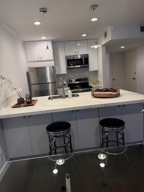 NEW PRICE. Welcome to your hilltop retreat in the San Carlos hills. This 1 bedroom, 1 bath condo is nestled amongst hiking trails and parks. The open kitchen is perfect for entertaining guests or trying out that special recipe. The spacious bar dining area, with high-end Neolith countertops, is ideal for hosting dinner parties or casual buffet dining. Stainless steel appliances and tons of storage are also included in the kitchen. The bedroom is complete with a walk-in organized closet that offers ample storage for all your belongings. The unit also has a laundry room with washer/dryer included and cabinets for additional storage. Hardwood floors throughout the unit. The community includes a clubhouse, several pools, lighted tennis courts, and play areas. The complex is conveniently located with quick and easy access to 280.