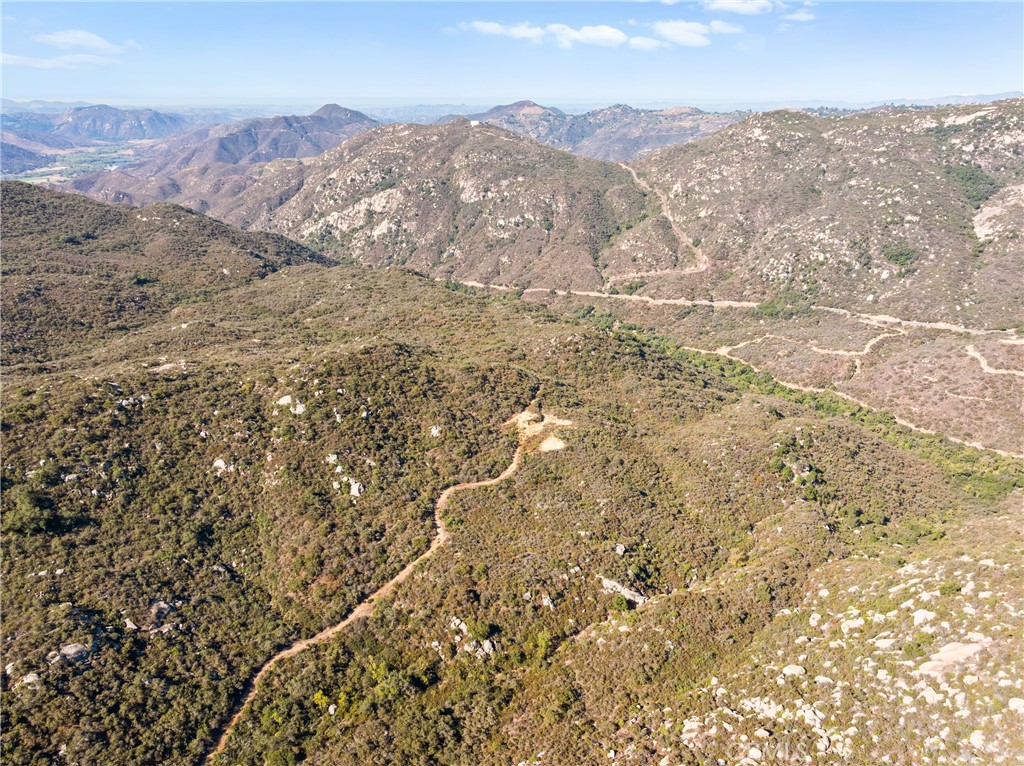 Priced to Sell! Own over 76 Acres in Rancho Heights with Endless Potential!
This extraordinary property spans two parcels totaling 76 acres in the coveted gated community of Rancho Heights, offering an unparalleled opportunity for both custom homebuyers and visionary developers. For those looking to build a private custom estate, the land offers 360-degree panoramic views and mature topography, creating a breathtaking backdrop for your dream home. Imagine waking up to rolling hills, serene privacy, and star-filled night skies, all while being just minutes from shopping, dining, and Temecula’s famous wine country. For investors and developers, this property presents unlimited potential. With its size, location, and natural landscape, it is truly a blank canvas ready for a wide range of possibilities. The Rancho Heights community, dating back to the 1960s, is known for its exclusivity, scenic beauty, and long-term desirability, making this a smart addition to any investment portfolio. Perfectly located, the property sits close to Pechanga Resort & Casino, Pala Casino, and Temecula, offering both seclusion and convenience. Residents and future buyers alike will enjoy quick access to world-class entertainment, vibrant shopping, dining, and Southern California’s renowned vineyards. With unmatched views, privacy, and accessibility, this property is more than just land—it’s an opportunity to create something extraordinary. Whether you’re envisioning your personal retreat or seeking a lucrative development project, Rancho Heights offers a rare chance to bring your vision to life.