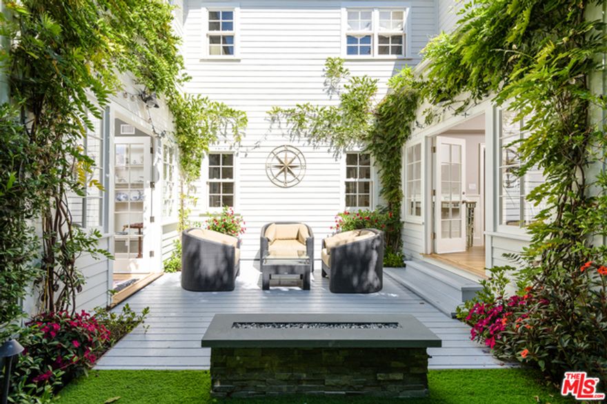 Seldom do we see a home with superior craftsmanship and excellent quality materials like 421 23rd Street.   3-levels East Coast Traditional,  5 bedrooms and 6 bathrooms over 6,500 square feet of space designed for warm and fun entertainment.  Enter the red front door and see the long hallway, on your right is the study and the comfortable step down living room with a brick fireplace & chandelier.  Both, the spacious formal dining and living room, open to a cozy outdoor patio warmed by a fire pit.  The indoor and outdoor flow is just superb.  The large gourmet kitchen is a Chef's dream with  double farmhouse sinks, all top-of-the-line Viking appliances (including 2 dishwashers,  warming drawer), custom cabinetry, and walk-in pantry.  The beautiful crown and floor moldings and gleaming dark hardwood floors add to this home's elegance. The lower level  has an enormous  media/game room, gym (with steam shower) and powder room.   Upstairs, one will find the generous master suite with high v