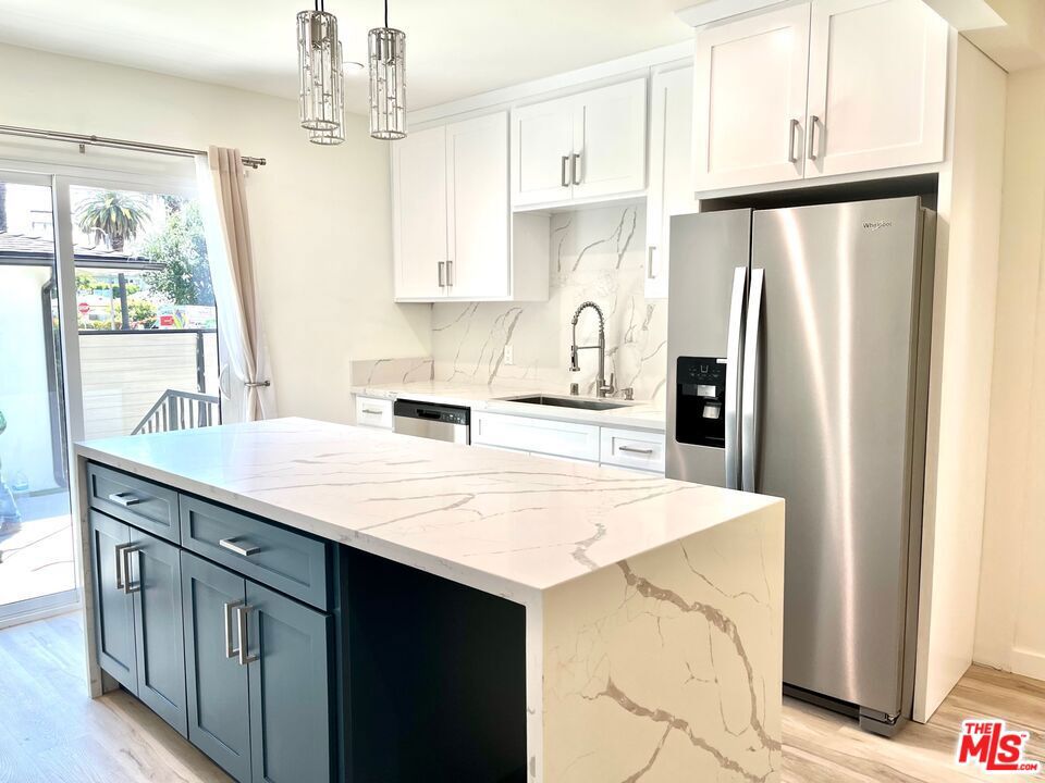 Beautifully remodeled English Cottage in Downtown Culver City, just blocks to the shops and restaurants on Culver Blvd and close to Carlson Park. Single-level stand alone house with 3 bedrooms and 2 baths, plus a private backyard. Gorgeous kitchen with a center island, quartz counters and stainless steel appliances. Includes washer, dryer, refrigerator, dishwasher and microwave. Light wood laminate floors, recessed lighting, newer double-pane windows. Living rm with decorative fireplace looks out to the private front yard. Primary en-suite bedroom and bath. 2 guest rooms and a hallway bath. Central heat and A/C. Gardener included. Avail now for 1 year or longer. One Small pet considered.