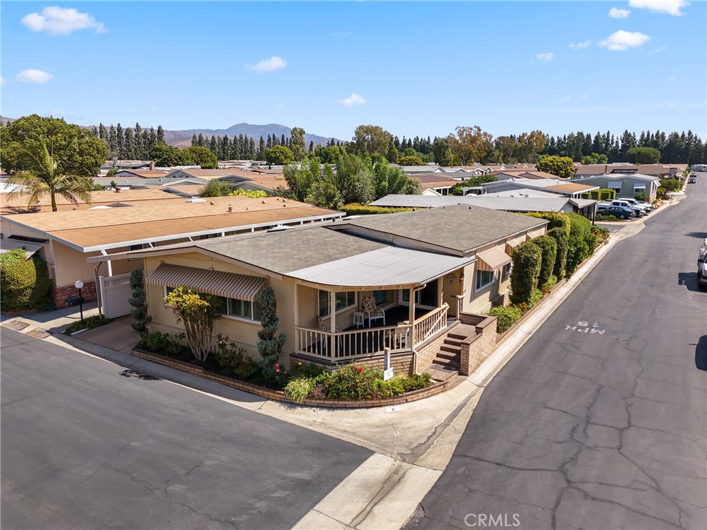 Welcome to The Groves — Irvine’s best-kept secret for active 55+ living!
Set within a secure, gated community with a 24/7 attendant, The Groves combines comfort, connection, and peace of mind—all with the added benefit of true land ownership, not space rent. This beautifully maintained 2-bedroom, 2-bath home offers a bright, inviting floor plan. The light-filled kitchen, complete with a breakfast nook, opens to an oversized family room—perfect for entertaining or hosting family visits. A formal dining area adds elegance, while additional living space provides flexibility for your lifestyle. The primary suite impresses with its generous size, dual closets, dual vanity bathroom, soaking tub, and separate shower. The second bedroom is equally spacious, with its own attached bath. A convenient indoor laundry room makes everyday living easy. This home is newly updated with a newer roof of 3years, newer AC, newer earthquake bracing and recent sealing of the skirting. What truly sets The Groves apart is its vibrant community spirit and impressive amenities. Residents enjoy a recently renovated heated pool and spa, fitness center, sauna, pickleball, tennis, and basketball courts, a putting green, lawn bowling, and a stunning clubhouse with banquet halls, lounges, and game rooms featuring billiards, poker, and ping pong. For those with a creative spark, there’s a ceramic studio, fully equipped woodshop, and community garden. Everyday conveniences include an on-site salon, BBQ areas with outdoor seating, RV parking, and even a dedicated car wash. With a full-time management team and activities coordinator, life here is as engaging as you choose—whether that’s joining clubs, attending themed events, volunteering, or simply enjoying spontaneous walks with neighbors. Residents often describe The Groves as the “Bubble within the Bubble”—a warm, welcoming oasis where friendships flourish and life moves at just the right pace. Low monthly fees and discounted Cox TV and Internet make living here as practical as it is enjoyable.
Don’t miss your chance to join this extraordinary community. At The Groves, comfort, safety, and connection come together to create a lifestyle you’ll love calling home.