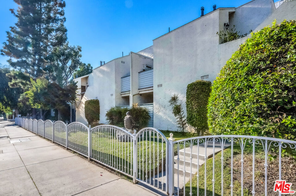 Beautifully remodeled and private end unit townhome with an attached two-car garage. This home was thoughtfully remodeled in 2020 and includes a new A/C system for year-round comfort. The main level features high ceilings, a welcoming living room with a private patio, and a convenient powder room for guests. The kitchen is a true highlight, designed with a gas line for cooking, sleek Quartz countertops, ample cabinetry, and a charming bay window that fills the space with natural light. Upstairs, you'll find two well-appointed bedrooms and one full bath. The spacious primary suite boasts double-door entry, a walk-in closet, and a private balcony. A stacked washer and dryer upstairs add modern convenience, ease and functionality. Residents also enjoy an array of community amenities, including plenty of guest parking, a sparkling pool, jacuzzi, sauna, recreation room, gym, recreation room with billiard table, half-Court Basketball and paddle tennis court. A perfect blend of comfort and style- completely move-in ready!