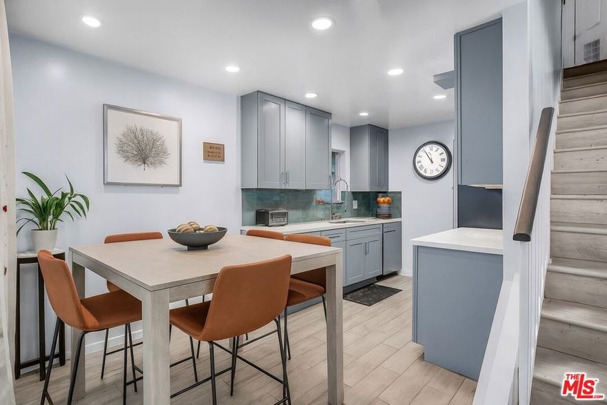 Beautifully remodeled and private end unit townhome with an attached two-car garage. This home was thoughtfully remodeled in 2020 and includes a new A/C system for year-round comfort. The main level features high ceilings, a welcoming living room with a private patio, and a convenient powder room for guests. The kitchen is a true highlight, designed with a gas line for cooking, sleek Quartz countertops, ample cabinetry, and a charming bay window that fills the space with natural light. Upstairs, you'll find two well-appointed bedrooms and one full bath. The spacious primary suite boasts double-door entry, a walk-in closet, and a private balcony. A stacked washer and dryer upstairs add modern convenience, ease and functionality. Residents also enjoy an array of community amenities, including plenty of guest parking, a sparkling pool, jacuzzi, sauna, recreation room, gym, recreation room with billiard table, half-Court Basketball and paddle tennis court. A perfect blend of comfort and style- completely move-in ready!
