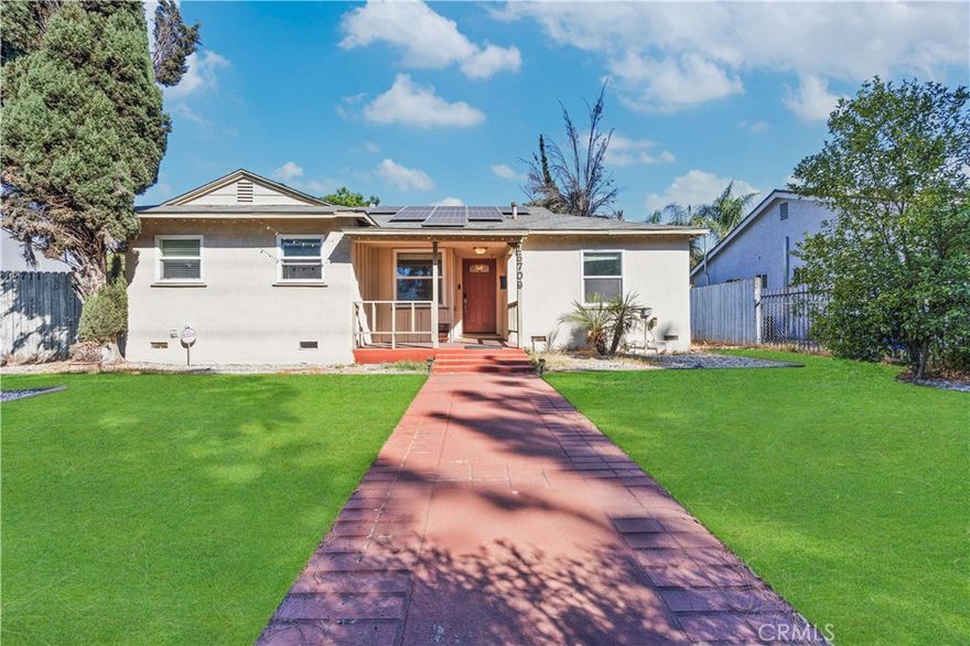 Nestled in one of Granada Hills’ most desirable neighborhoods, this beautifully updated single-story residence seamlessly blends modern comfort with versatile living. Featuring 5 bedrooms and 4 bathrooms, including a fully permitted one-bedroom, one-bath ADU with separate utilities, this home offers approximately 1,854 square feet of living space on a generous 7,801-square-foot lot. Step inside to an inviting, light-filled open floor plan adorned with large windows, stylish modern finishes, and thoughtfully designed spaces. The primary suite features dual en-suite baths, allowing for flexible living arrangements and added privacy. The main residence includes four bedrooms and three baths, while the detached ADU provides the perfect setup for multi-generational living or an excellent rental opportunity. Both the main home and ADU are equipped with paid-off solar panels, enhancing energy efficiency and reducing monthly costs. An electric gated entry offers added security and convenience, complemented by RV access, a gated driveway, and ample parking. The outdoor spaces are equally impressive, with a covered patio, paved entertaining areas, and beautifully landscaped yards offering a serene retreat. The kitchens boast granite countertops and tasteful modern upgrades throughout. Zoned LARD6 with no HOA, this property delivers the freedom and flexibility every homeowner desires. Ideally situated near major freeways, shopping, dining, and top-rated schools—including Haskell STEAM Magnet, George K. Porter Middle, and John F. Kennedy High—this home represents the perfect balance of lifestyle, location, and investment potential. Don’t miss the chance to own this exceptional Granada Hills gem—schedule your private showing today!