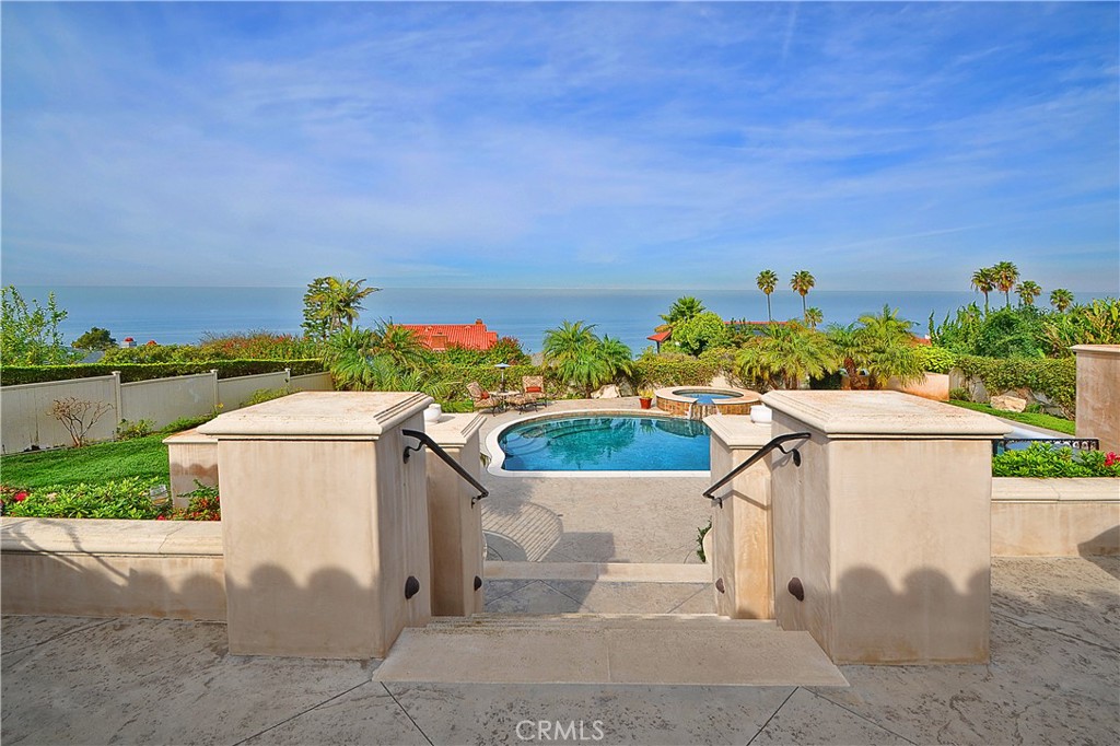 This one of a kind 4-bedroom custom home with resort-like backyard and incredible Malibu to Queen's Necklace view of the Pacific Ocean is located on one of the premier and most sought-after streets in Lunada Bay. This property has only had two owners in the last 75 years. It is rare to come to market. As you walk up to the courtyard entry, you can see straight through to the inspiring ocean view! The home features a formal living room, formal dining room, huge great room with breakfast area, custom built-ins throughout, custom tile work, vaulted ceilings, gourmet kitchen and loads of extra storage in the garage. Enjoy the gorgeous, private backyard with expansive ocean view with pool, spa, built-in BBQ, and patios galore for entertaining. Do not miss this exceptional property!