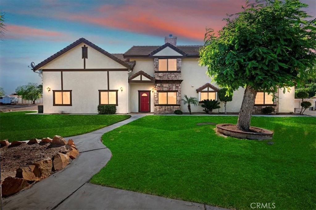 Nestled on 2.14 sprawling acres, this elegant Tudor-style estate, custom built in 1986 offers 3,604 sq ft of thoughtfully crafted living space. Boasting 4 bedrooms with the master and one bedroom on the ground floor, a formal dining room, an office/alternative craft room and a 3-car attached garage.
This gem offers modern amenities, but is country living at it's best with the convenience of shopping near by. The extensive bonus room upstairs overlooks the living room which features a beautiful stone fireplace that rises to the cathedral ceiling. This home is also equipped with a whole house built in vacuum system.
This expansive lot offers mature trees, ample outdoor usable land, horse corral, stables and barn! For the horse enthusiast, you can ride right out of your property onto open spaces.
This is a rare opportunity to own a country estate with endless possibilities, breath taking views from every window and covered back patio, cool evening breezes and beautiful sunsets.