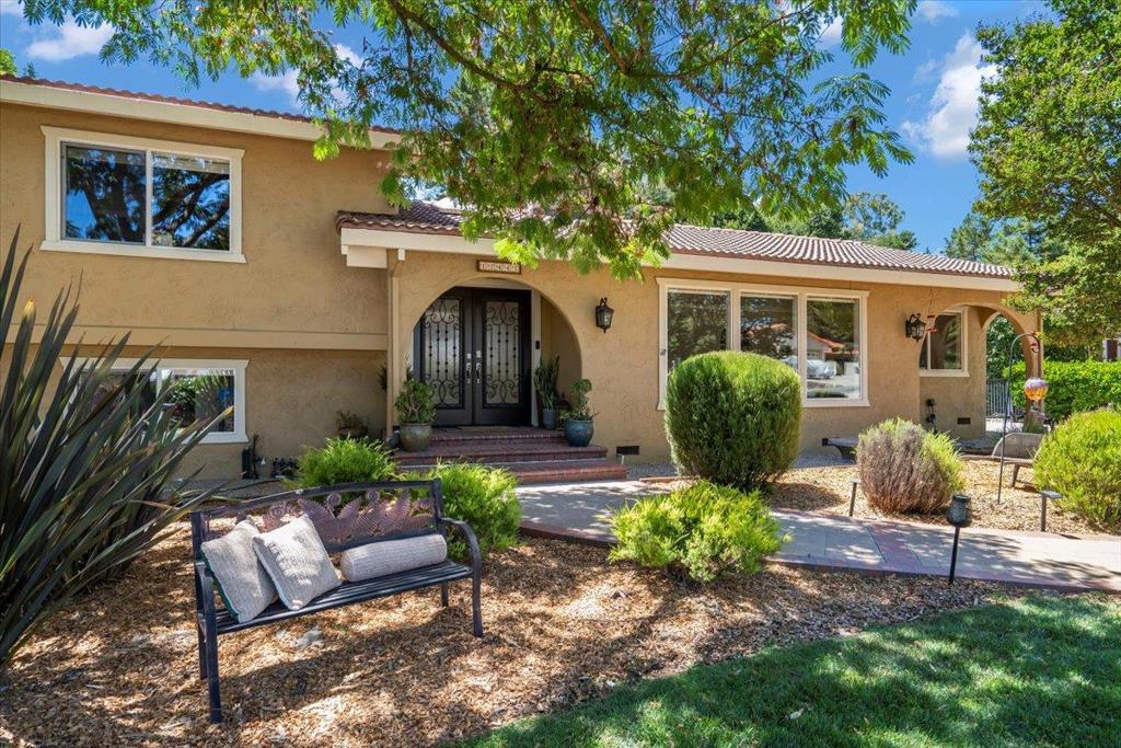 Welcome to your dream home on one of the most desirable streets in Holiday Lake Estates! This meticulously maintained, custom 4-bedroom, 3.5-bathroom home offers 2,618 sq ft , plus a 220 sq ft attached sunroom, totaling 2,838 sq ft of total living space. Custom front doors fill the spacious Interior rooms with natural light. The large gourmet kitchen with gas cooktop, stainless steel appliances, breakfast bar, and both casual and formal dining areas are perfect for entertaining. The 4th bedroom has easy potential as an in-law/next gen unit or guest suite with its own large walk in closet, fireplace and private bathroom. Relax and unwind in the separate living room, great for family gatherings or quiet evenings by the fireplace. Enjoy time outside in your lovely secluded backyard. Green and smart features include 27 owned solar panels with 2 Tesla Power Wall batteries eliminates or reduces your electric bill, EV ready, tankless water heater, high efficiency HVAC, and numerous wi-fi devices. Hardwood, tile, and carpet flooring. Additional features: primary suite with walk-in closet, indoor laundry (washer/dryer included), central A/C and heat, 3 fireplaces, and dual-pane windows, Plenty of parking with 3 car garage, a large long flat driveway enough for multiple vehicles and a RV.
