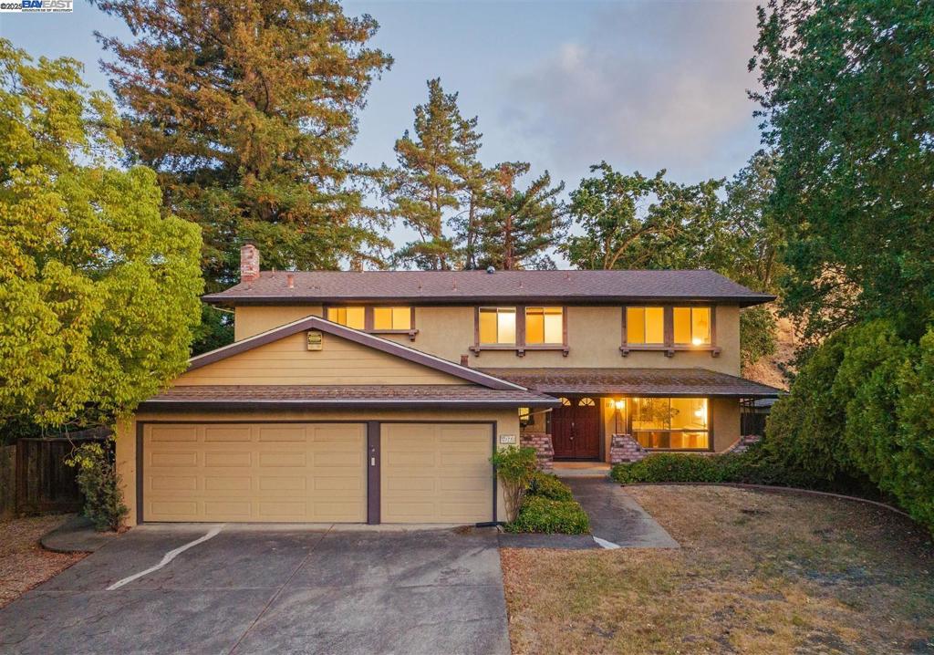 Premium lot with gorgeous hill views, located at the end of a quiet street, top-rated schools, and literally steps from scenic walking trails! Located in one of the most desirable Walnut Creek neighborhoods (Livorna Estates), this home offers a spacious 2,220 sq. ft. of living space on a huge 0.32-acre lot. It features a large primary suite (with a walk-in closet), 4 additional guest bedrooms, 3.5 total bathrooms, and a large attached 3-car garage. The home includes a spacious, light-filled living room and a separate family room with a cozy fireplace and glass sliding door to the backyard, enhancing the home with natural light. Wraparound countertops, vintage cabinetry, and a rare pass-through window connect the kitchen directly to the covered patio, ideal for effortless indoor-outdoor flow. The patio itself feels like an extension of the home with a ceiling fan, built-in serving bar, and space to dine or unwind under mature redwoods, perfect for hosting or everyday living. The home offers a large and private backyard framed by mature redwoods, offering a lot of space to play, garden, or customize to your needs, including adding an ADU with appropriate permits. A built-in basketball hoop and surrounding greenery make it ideal for both relaxation and recreation. Come check it out!