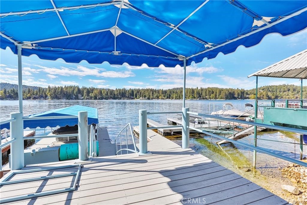 Tavern Bay 1/2 Double Dock. This dock offers a fabulous location near the Tavern Bay Beach Club. The views are expansive from the canvas covered deck. Never miss the 4th of July Firework Show, Village view and the beautiful mountain ridge views. Dock is in deep water and offers a private beach area perfect to swim from the shoreline or dive in from the dock. The Beach Club near by offers quick access to a snack shack, clean restrooms, picnic and playground area in a park like setting that is gated and private to ALA members only. The location and lifestyle is quintessential to Lake Arrowhead living.