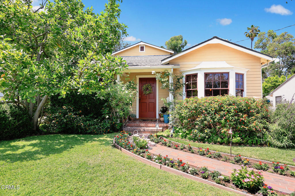 This charming South Pasadena residence radiates with eye-catching curb appeal, tugging at your heartstrings inviting you in. Offering a sought-after floor plan of 2,129 square feet and featuring updated amenities, professionally designed outdoor spaces and the architectural details of its 1939 build, 1116 Foothill Street embodies all that the word Home is meant to evoke, and is exactly what buyers desire. A lush yard with green foliage and colorful blossoms ushers guests along a delightful brick path to the welcoming front door. Upon entry, the Living room reveals pleasing warmth from original wood-framed windows, crown molding, Oak flooring and an appealing hearth and fireplace. The adjacent dining room replicates the architectural charm while flowing nicely to the large, updated kitchen with ample space to kraft meals and spark memories. The room features granite counters, a six-burner chef's range, decorative and recessed lighting, custom cabinet design and space for quick meals at the counter. Additionally, the room connects nicely to the family room space offering built-in bookshelves and cabinets as well as views and access to inviting patio spaces and a verdant rear yard for outdoor dining and a place to unwind. The home's functional layout reveals two well-sized bedrooms downstairs separated by an updated full bathroom and laundry closet for maximum efficiency and convenience. There is also a much-desired CA basement for practical storage options. The second floor showcases a large and private primary bedroom suite with delightful tree-top views, a walk-in closet, an updated 4-piece ensuite bath, featuring a two-person soaking tub. In addition, at the top of the stairs, there is bonus space large enough for a home office or at-home workouts. And, do not forget to ask about the ample storage this home conceals in its walk-in attic space. Additional features include a bolted foundation, brand-new tankless water heater, newer windows for most of the home, zoned A/C and heating system and professionally landscaped garden spaces with multiple fruit trees and an array of flowering plants. This South Pasadena home is located a few short blocks from favorites like Jones Coffee, Mike & Anne's, Mission Wines, the Dinosaur Farm & the weekly Farmer's Market. With Blue Ribbon schools and South Pas community events, Foothill Street is a wonderful place to call Home.