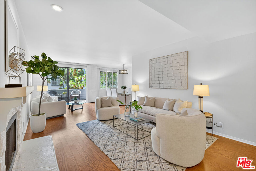 Welcome to quintessential Southern California beach living in this beautifully refreshed 2-bedroom, 2-bathroom condo, ideally located on the coveted Marina del Rey Peninsula. Spanning 1,613 square feet, this spacious residence offers a rare opportunity to be only the second owner of a home that blends coastal charm with modern convenience. Step into a proper foyer entry that opens into an expansive living area, perfect for entertaining or relaxing. Enjoy a cozy evening by the fireplace, mix a drink at the wet bar, or let the ocean breeze flow through the oversized floor-to-ceiling sliding doors that lead to your exclusive private balcony. The updated kitchen is equipped with a brand-new stainless steel range/oven, microwave, and refrigerator, along with a charming breakfast nook for casual dining. The primary suite is a true retreat, offering high ceilings, brand-new carpeting, generous closet space, and a spacious ensuite bath with dual vanities, a separate soaking tub, and a glass-enclosed shower. Additional highlights include a dedicated laundry room with ample storage, central AC and heating, and beautiful natural light throughout. Residents enjoy access to premium building amenities including a pool, spa, gym, and sauna. The unit also includes two tandem parking spaces and a dedicated storage unit. Live just moments from the sand, with effortless access to the Marina, trendy Venice Beach, and the shops and restaurants of Abbot Kinney Boulevard. Whether you're paddleboarding in the marina, strolling the boardwalk, or enjoying the area's vibrant food scene, this is true coastal California living.