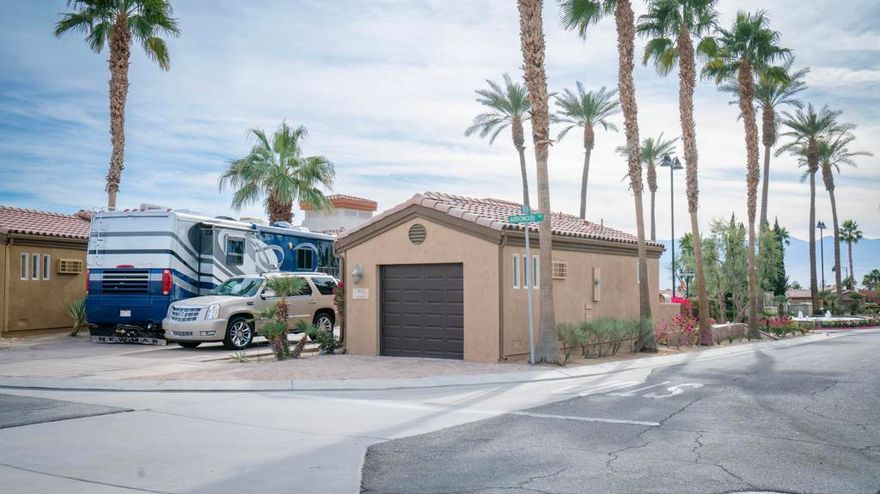 This property features an on-site built garage with a spacious laundry area and a full bathroom. The garage is incredibly versatile -use it as an extra bedroom, office, game room, den, or a comfortable guest space. Take full advantage of the huge RV parking area, designed specifically for your Class A RV, with all the necessary hookups included. Enjoy breathtaking panoramic mountain views in the serene and beautifully maintained Vineyards Luxury Motorcoach Resort. This all-ages community offers a welcoming and relaxing lifestyle. With its functional layout and stunning setting, this property is perfect for those seeking flexibility, comfort, and outdoor living!