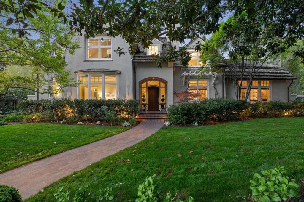 Set on a private and expansive 0.57-acre gated parcel in one of Palo Alto's most coveted neighborhoods, this exceptional estate blends timeless elegance, exquisite craftsmanship and seamless indoor-outdoor living. With 6 bedrooms plus a detached studio, 6.5 baths, a sparkling pool and spa and beautifully designed living spaces, it offers the ideal balance of sophistication and comfort for both day-to-day living and refined entertaining. Formal living and dining rooms exude understated luxury, while the chef's kitchen - with stainless appliances and custom cabinetry - flows effortlessly into the informal living spaces. A dramatic double-sided fireplace anchors the expansive family and recreation rooms. Two main-level bedrooms complement four upstairs, including a luxurious primary suite with soaking tub, dual vanities and dual walk-in closets. The detached studio above the 3-car garage, complete with full bath, offers ideal flexibility for guests, a home office, au pair, or teen retreat. Outside, a lush, resort-style oasis awaits - mature landscaping, fire pit, koi pond, and lawn surround the inviting pool and spa. Multiple dining and lounging areas, a built-in BBQ and a gated motor court enhance the property. Located near Meta, Google, Apple, Stanford & top Palo Alto schools.