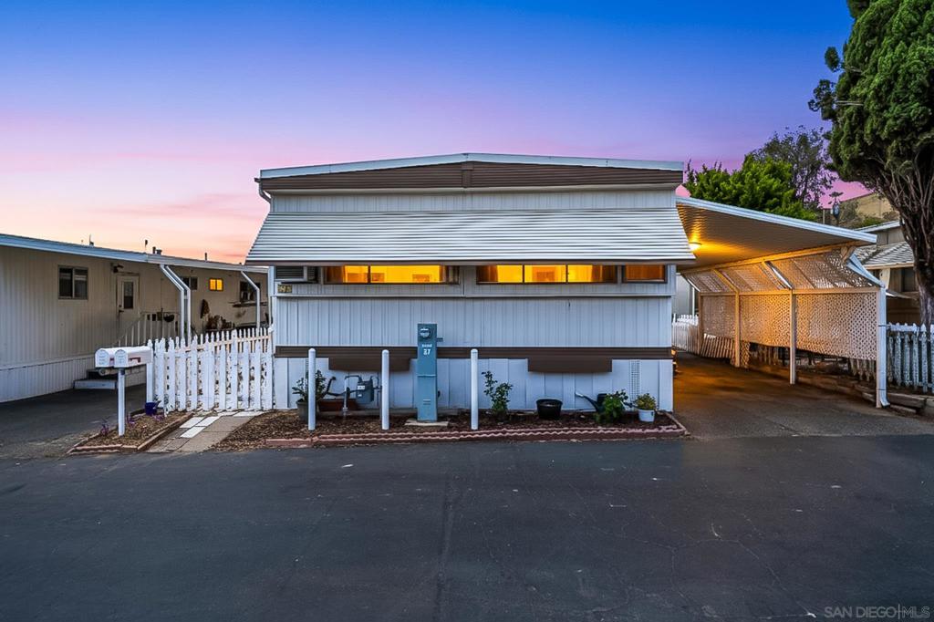 Welcome to Your Turnkey Home in the Heart of El Cajon! Step into this beautifully maintained 2-bedroom, 2-bath manufactured home nestled in the desirable gate-secured community of Starlight Mobile Home Park. With a spacious open floor plan, this home features updated laminate flooring, abundant natural light, and a large living area perfect for entertaining or relaxing. The kitchen boasts ample cabinet space, a breakfast bar, and a seamless flow into the dining area. Enjoy generously sized bedrooms, including a primary suite with its own private bathroom and walk-in closet. Outside, take advantage of a covered carport, private patio area, and additional storage shed—ideal for California living. Community amenities include a pool, clubhouse, laundry facilities, and guest parking. Conveniently located near shopping, dining, freeway access, and top-rated schools, this home offers both comfort and convenience. Park is all-ages—don’t miss this opportunity!