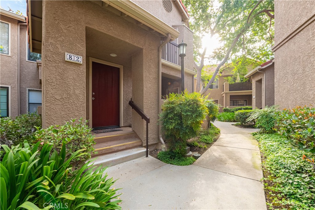 Welcome to this gorgeous upstairs condo located in a quiet, well-maintained community in East Simi. Featuring 2 spacious bedrooms and 1 remodeled bath, this move-in-ready home offers comfort, style, and convenience. Step inside to discover wood-look laminate flooring throughout, a freshly painted interior, and an inviting open-concept living and dining area with soaring vaulted ceilings that create a bright, airy ambiance. The updated kitchen is a true highlight, showcasing granite countertops, modern cabinetry, and stainless steel appliances—with refrigerator included! A convenient breakfast bar connects the kitchen to the living space, perfect for casual dining or entertaining. The upgraded bathroom features newer tile flooring, a modern vanity, and updated countertops and sink. You'll also appreciate ample storage throughout, plus the included stackable washer and dryer for added convenience. Enjoy resort-style amenities with a community pool and spa, and benefit from your own detached 1-car garage and 1 designated parking space. This condo is spotless, stylish, and truly move-in ready—schedule your showing today!