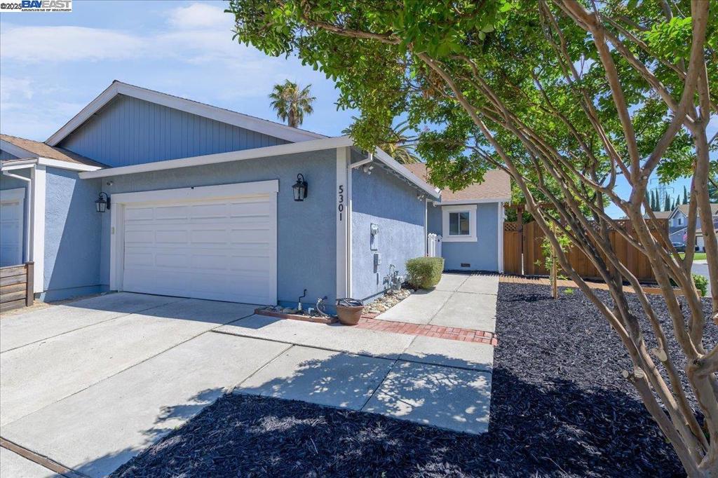 Delightfully designed and dialed-in Duet! NO HOA! This turnkey, single story, North facing home sits on a large corner lot. Beautiful curb appeal viewing a spacious front yard, newer fencing and 2 car garage. Enter the white picket fence to the covered walkway between the garage and the house. Open concept kitchen and living room. Peninsula style island in the kitchen adds extra cabinets, counter space as well as a breakfast bar. Range and hood new as of March(2025). Recessed lighting in kitchen/living room; some light fixtures added & replaced(2025). Reverse osmosis filterting system(2024) underneath large stainless steel kitchen sink. Plenty of natural light in the living space with the large sliding glass door overlooking the beautiful backyard. New carpet in both bedrooms and new interior paint. Primary suite includes a large bedroom, his & hers closet plus an updated bathroom. Plenty of space in the private & shaded backyard with turf(2023), a pergola over the patio area and a side yard. Garage equipped with water softener(2024) and laundry area. Wonderful home awaiting a new owner. Great for first time home buyers, small families and those looking to downsize. Don't miss this one!