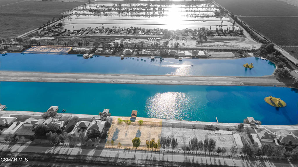 Extraordinary unique opportunity to build your own custom estate with a dock on a private lake!! This lot is one of three lots available on Paradise Lakes in Arvin California. The remarkable gated community is truly one of a kind. Paradise Lakes Estates has its own private airstrip between the two lakes that can accommodate all single engine and some twin-engine aircrafts. It is the only lake in the area that allows larger 23.5 ft wakeboarding boats to be used. Build your own custom dream home next to world class competition ski lakes and create memories that will last a lifetime! Don't miss out on this rare opportunity, call for much more information!