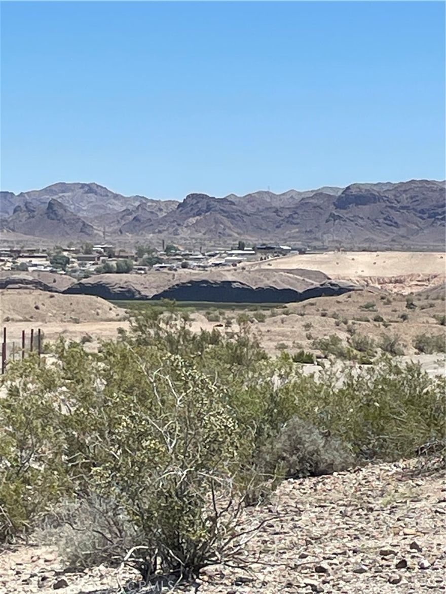 Great lot for Home & Garage, Close to the lake, Located in Havasu Lake, Ca (unincorporated Needles) Town has a full size grocery store, restaurants, Casino, Hotel, Hardware Store, Post Office, 2 Marinas w/Launch ramps, Gas and rental boat slips.

panoramic desert views, City lights views, Full time neighbors nearby