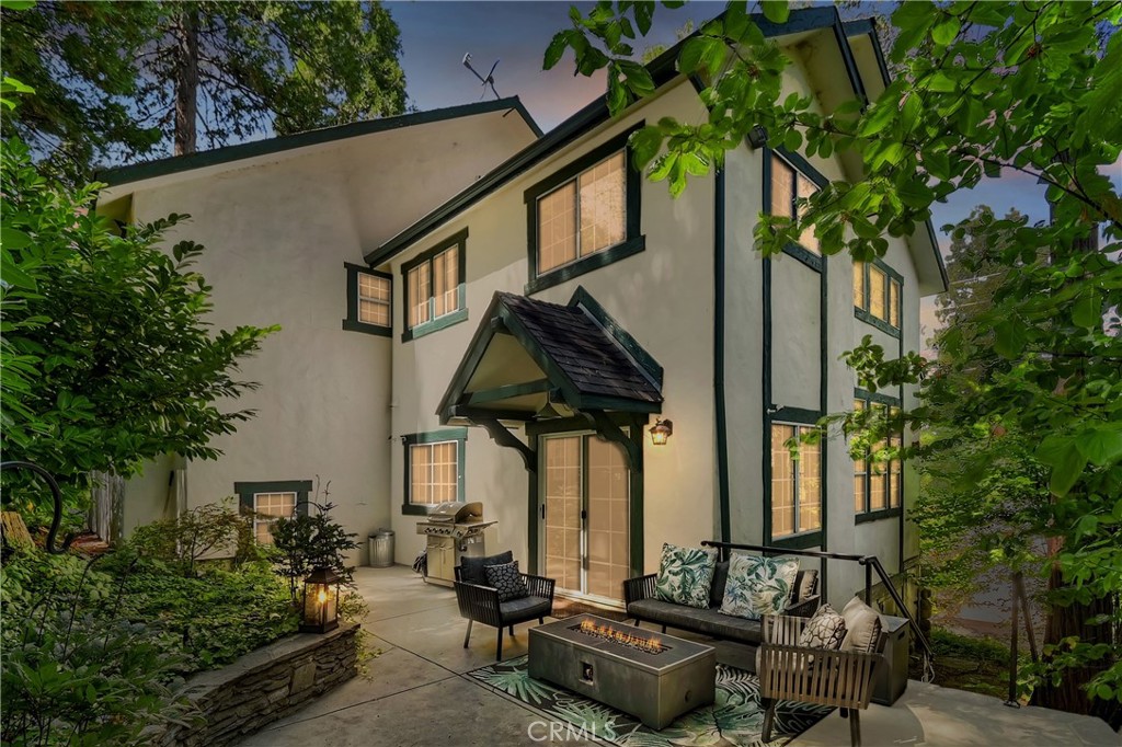 Nestled back among the dogwoods, this beautifully landscaped Lake Arrowhead home combines mountain charm with modern living. With level entry and a two-car garage, ease meets elegance from the start. Enter off of the front porch that invites you in to discover your next adventure.
Inside, the great room impresses with floor-to-ceiling windows, dark wood beams, river rock fireplace, and rich flooring. The open-concept design flows into the gourmet kitchen featuring stainless steel appliances and sliding glass door to the back patio off of dining, perfect for entertaining and a fire pit to sit back and relax in your outdoor retreat area. A half bath completes the main level.
Upstairs, discover three comfortable bedrooms and a laundry area, highlighted by the primary suite with its own fireplace and a private balcony draped in climbing wisteria serene mountain retreat.
The lower-level bonus room offers flexibility as a movie theater, game room, or private hideaway.
Adding to the lifestyle, a dock is available for purchase just steps away in one of Lake Arrowheads most desirable spots near the Resort, Yacht Club, and a short walk to the Village for dining and shopping. Boat available for purchase as well outside of escrow..
Offered turn-key furnished, this home is ready to enjoy from day one. A few of the amenities of this home are: fire sprinklers throughout, snow blower, central air and heating, back up generator, 5 flat screen TV's with Apple TV, central vacuum and full alarm system.