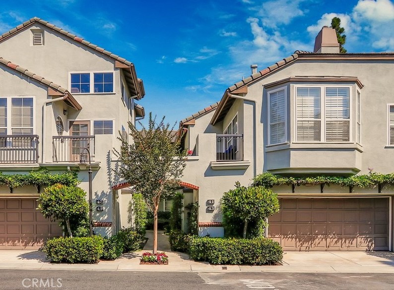 Sophisticated & Elegant Townhome in The Summit Gated Community - Nestled in the heart of the prestigious gated community The Summit, this stunning 3-bedroom, 3-bathroom townhome offers timeless elegance, impeccable condition, and exceptional indoor-outdoor living. Freshly painted with stylish décor throughout, this home is move-in ready. The inviting layout includes formal living and family rooms, seamlessly connected by a see-through fireplace, and enhanced by soaring ceilings that fill the space with natural light. Custom built-in cabinetry, bookcases, plantation shutters, and designer window treatments add to the refined charm. The oversized gourmet kitchen boasts expansive counter space, perfect for entertaining, and flows effortlessly into the breakfast area and family room. Step outside to your beautifully landscaped private patio with direct access to one of the largest yards available in this model—an ideal space for relaxing or entertaining. Upstairs, the luxurious primary suite features a walk-in closet, spa-like bathroom with soaking tub, separate glass shower, and dual vanities. Additional highlights include a 2-car attached garage with direct access and a full bedroom and bath on the main level—perfect for guests or a home office. Enjoy resort-style amenities including a heated pool, spa, and lush landscaping, all within minutes of world-class shopping, dining, freeway access, and Newport Beach's finest coastal attractions. Don't miss this rare opportunity—schedule your private tour today!