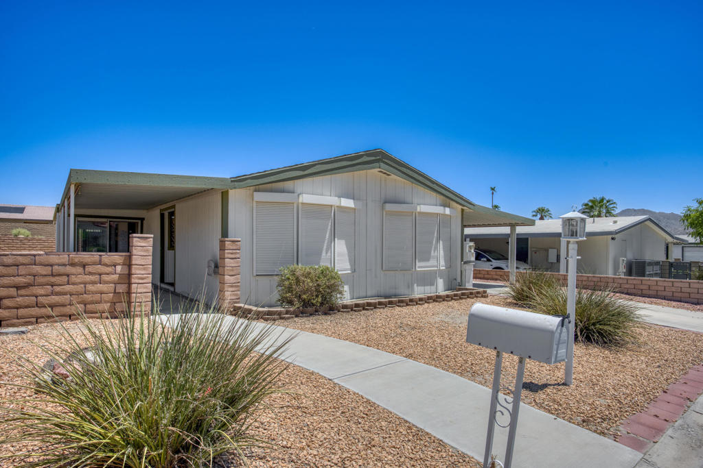 Charming 2-bedroom, 2-bath manufactured home in Palm Desert's Portola Country Club--a vibrant 55+ gated community offering free golf, pickleball, bocce ball, tennis, three pools, and clubhouse activities. This well-maintained single-story home features 1,440 sq ft of living space on a permanent foundation, built in 1987, with central air, dual-pane windows, and a spacious open layout ready for immediate enjoyment or personal touches.Set on a 3,920 sq ft lot, the property includes three inviting patios surrounded by mature landscaping, creating the perfect outdoor retreat. The bright living and dining areas flow seamlessly into a functional kitchen with plenty of storage.Enjoy the comfort, convenience, and lifestyle of desert living at its best!
