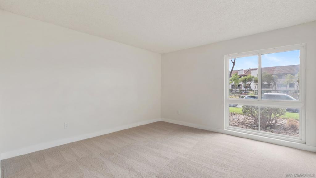 Centrally located renovated bottom floor south facing condo located on the exterior edge of the complex with direct access from Friars Road. Kitchen now boasts the following newly installed items: soft touch cabinets & drawers (Harbor Grey), Butcher Block counter top, sink & garbage disposal. New electrical outlets throughout with GFCI’s installed in the kitchen & bathrooms. Kitchen & bedrooms painted in Swiss Coffee & coated with the Egg Shell semi-gloss. Baseboards (new), door jams & doors painted in Pure White & coated with the Egg Shell semi-gloss. Entire ceiling newly painted. Brand new carpet & door handles throughout. New light fixtures in the dining room (to include new ceiling fan), hallway &primary bathroom hallway. Tile floor in the primary bathroom is newly installed. Dual pane windows & sliding glass door provide enhanced tranquility as well as facilitates easy entry into the unit for visitors from Friars. Three newly installed smoke detectors. New cabinets, two vanity sinks & medicine cabinets, overhead fans, toilet, fiber glass shower / trim with two sliding glass bypass doors newly installed in the primary bathroom. Newly installed shower cutoff valve (not visible) which allows for unimpeded repairs &/or changes. Second bathroom boasts newly installed toilet, fixtures, medicine cabinets, shower faucets & trim. Exceedingly close proximity to major freeway access, two shopping malls, restaurants, the Y, University of San Diego, Sea World, Mission Bay & the beaches. Come see for yourself what this dwelling has to offer! Substantial closet & storage space throughout. In unit laundry hookups have been installed (no exhaust outlet) with utilization subject to HOA approval. Community laundry room located at end of main hallway. HOA pays for basic cable & the service provider is Spectrum.