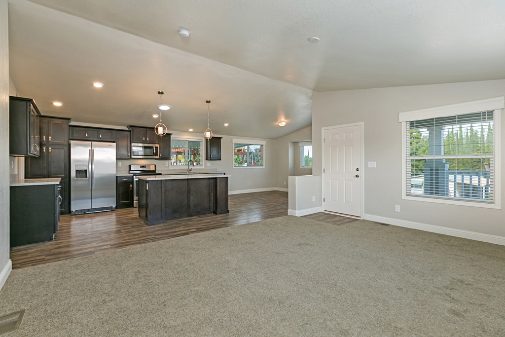 Rare opportunity! This beautiful manufactured home is LAND OWNED and located in a gated, family friendly community that is FHA and VA approved! This 2018 home model has a bright, open concept layout and luxury kitchen and baths featuring stainless steel appliances, quartz countertops and soft touch, solid wood cabinetry. Room to park three vehicles and conveniently located near guest parking. Spacious lot has tons of potential for adding grass, more parking or enjoying the view from the rear facing deck. Neighborhoods: Escondido Views Other Fees: 0 Sewer: Sewer Connected Topography: LL,