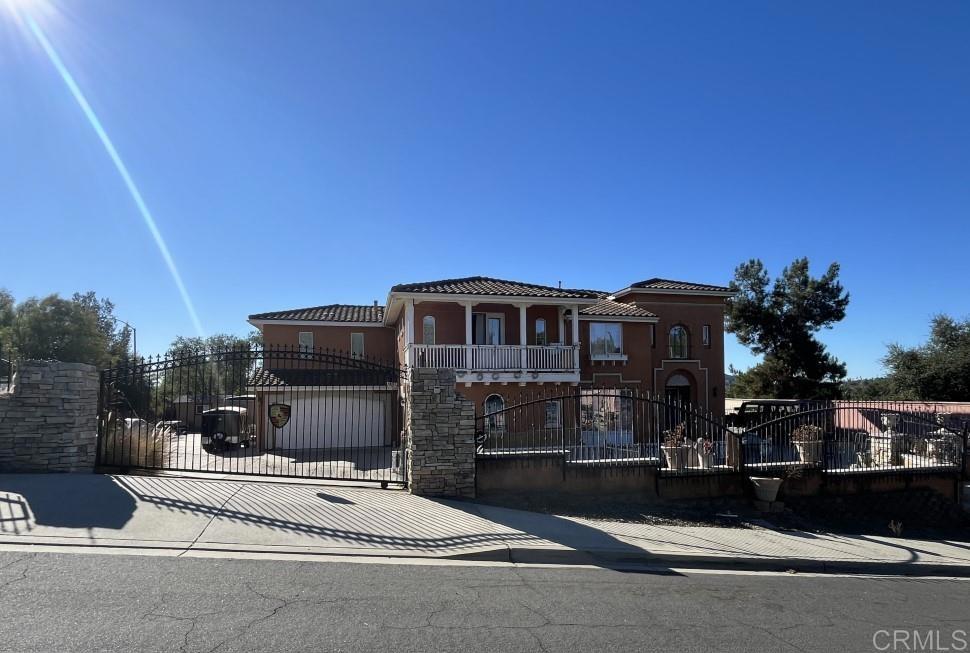 Welcome to 303 Amparo Dr, a striking 5-bed / 4.5-bath estate offering 4,084 sq ft of refined living on a generous 0.47-acre parcel in Escondido’s desirable Kit Carson area. Built in 2003, this beautifully appointed home features an open floor plan, high ceilings, and abundant natural light. The chef’s kitchen flows seamlessly into the great room and formal dining area, while private secondary bedrooms and a luxurious primary suite ensure comfort. Nestled in a quiet neighborhood with convenient access to schools, shopping, and freeway corridors, this is an exceptional opportunity to own a showcase residence in Escondido.