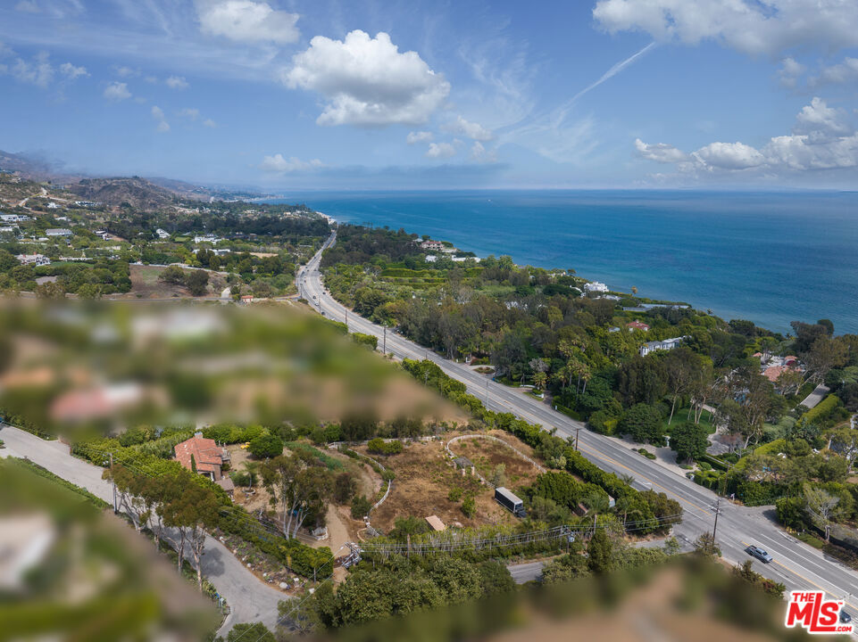 Positioned on over an acre in one of Malibu's most sought-after enclaves, 27950 Winding Way offers a rare opportunity to restore a classic Mediterranean estate or build a new vision from the ground up. Set behind mature landscaping and surrounded by panoramic ocean and mountain views, the property captures the essence of coastal California living.The existing residence is rich with architectural characterterra cotta rooflines, arched openings, wrought-iron balconies, and grand columnsoffering a timeless foundation for restoration. Expansive grounds feature mature trees, a central fountain, and multiple outdoor areas with space to expand, reimagine, or completely redesign.Located moments from sandy beaches, scenic trails, and the best of Malibu's dining and amenities, this exceptional parcel invites endless possibilities in a location that defines luxury and legacy.