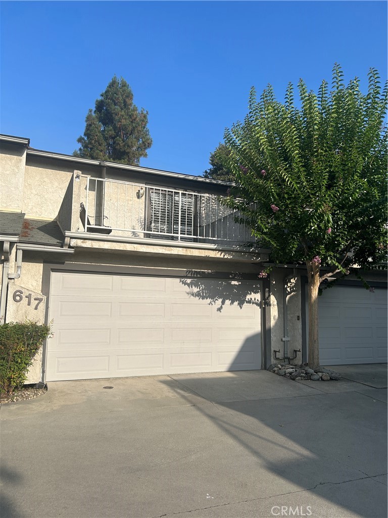 FOR LEASE Two-Story Townhome in Monrovia! Welcome to this well-maintained two-level townhome, ideally situated near a neighborhood park, a convenient shopping center, and all the charm Monrovia has to offer. This inviting home features 2 bedrooms and 1.5 bathrooms. The primary bedroom includes a private balcony overlooking the community, a large walk-in closet, and direct access to the full bathroom. The full bathroom also includes a separate vanity area and an additional entrance from the hallway for added convenience. Enjoy ample storage space throughout the home, with additional storage closets both upstairs and downstairs. The main level offers a comfortable living room with a sliding glass door leading to a enclosed patio. There's also a dining area and a galley-style kitchen that has stainless steel appliances. There is a range, microwave rangehood and dishwasher. The home includes an attached two-car garage with washer and dryer hookups, as well as central air and heat to keep you comfortable year-round. Don't miss this opportunity to live in well-located Monrovia townhome community!