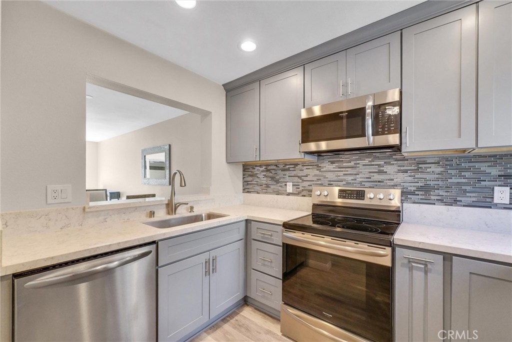 ***Value Range Price $598,000-$628,000***Must see this exceptional condo located in the beautiful Hills of Orange! This two-story home offers a fantastic floor plan with the added privacy of no rear neighbors.
Property has been completely remodeled. Gorgeous kitchen with soft close technology cabinetry, stunning quartz countertops, stainless steel appliances including microwave and subway tile on wall. Beautiful water proof flooring, LED lighting, Milgard windows and slider door. Welcoming living room provides a cozy atmosphere with remodeled fireplace.
Step outside to the enclosed patio yard, an ideal space for pets, featuring vinyl fencing, nice slab floor. Upstairs, the lovely primary bedroom boasts views of the hills and an exquisite remodeled bathroom with a skylight, luxurious cabinetry, countertop, and shower/soak tub.
Additional great features include full-size indoor washer/dryer, remodeled guest bathroom downstairs and upgraded HVAC system .
Enjoy the wonderful surroundings with nearby walk paths and hiking trails just across Cannon St. You'll also appreciate the convenient access to toll roads, Peter's Canyon, Irvine Regional Park, and the 55/91 freeways.
The community offers fantastic amenities, including a resort-style pool, spa, and barbecues, along with a club house. As a significant bonus, there are no Mello Roos taxes associated with this property.