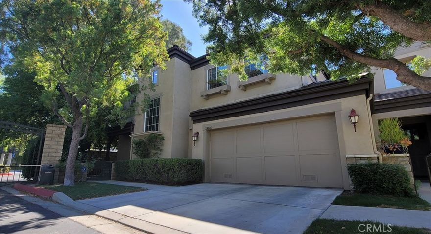 Beautiful Valencia 'Avignon Gated Community"  Executive Townhome.  ** NO Mello Roos Taxes** .  Location-Location-Location.   This rare townhome location includes a lushly landscaped rear patio and yard directly overlooking the 16th green at Valencia CC.  This is the 3 bedroom floorplan however the 3rd bedroom option is/was configured as an open loft.  This layout includes living, family and dining areas.  Two sided fireplace in both the living & family rooms.  Spacious kitchen featuring lots of granite counter and cabinet space.  Counter seating bar for more casual meals.  Expansive windows with plantation shutters throughout showcasing the rear patio yard, and golf course.  Light bright throughout.  The primary bedroom overlooks the golf course and features a two way fireplace connecting to the primary bathroom suite. Double door walk in closet adjacent to the primary bathroom suite.  The 2nd upstairs bedroom has it's own en-suite full bath.  Inside Laundry room.  Direct garage access.  Garage features extensive storage cabinets.  Relaxing outdoor lifestyle offers a covered patio, fountain, firepit, fruit trees and secluded golf course viewing area plus a side yard  with a storage unit.  Recently installed high efficiency Heat Pump FAU for central heating and cooling.   Avignon community amenities include the recreation center with pool, Spa, lounge & firepit area plus lushly landscaped grounds with relaxing seating areas for pleasant strolls without leaving the Avignon community.  Short stroll to the Valencia Town Center featuring shopping, restaurants, fitness center, mall and more.