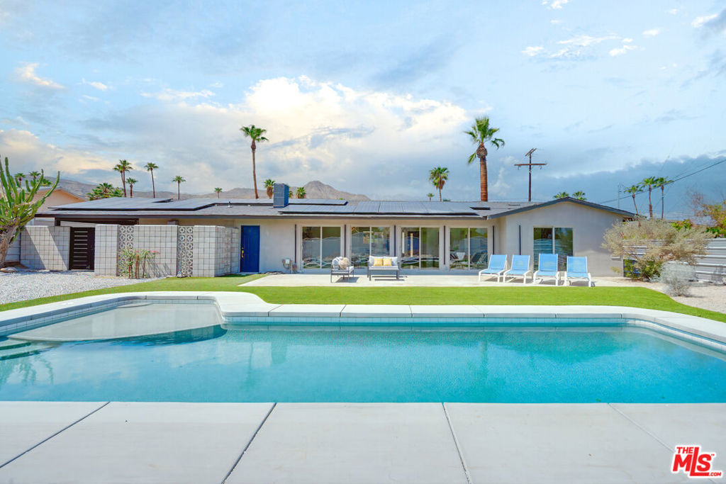 The Upper Cathedral City Cove has long been a haven for artists, free spirits, and lovers of eclectic design, and this 4-bedroom, 3.5-bath modern reinvention fits right in. Priced just under a February 2025 appraisal value, the home sets the stage that blurs the lines between indoors and out, natural and high-concept light, and traditional and modern living. Metallic epoxy floors, walls of glass, and year-round views of the Santa Rosa Mountains create an ambiance that makes the entire home feel like an art installation. Almost every bedroom has its own bath, while the chef's kitchen pairs quartz counters, custom cabinetry, and stainless steel appliances with an energetic flow into both the indoor and outdoor spaces. The backyard is a private escape featuring a sparkling pool, a privacy wall, and drip-irrigated, desert-centric landscaping. Upgrades include a new roof, a new AC/heat pump, an updated electrical panel, a new plumbing line to the street, new insulation, irrigation, and solar panels with an assumable agreement. Even firepit hookups are ready! The Cove offers temperate weather, natural wind protection, and a history as a creative enclave. Minutes from Trader Joe's, Agua Caliente Casino, CVRep Theatre, the Mary Pickford Theatre, brand-new Chipotle and Starbucks, plus hiking, breweries, and boutiques, you're not just buying a home, you're stepping into the lifestyle that makes this neighborhood legendary.
