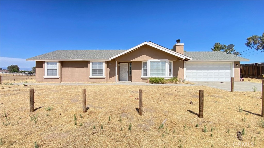 Welcome to this fascinating property situated in Madera city! This well-maintained home nestled on 2.25 acre land in a beautiful neighborhood. 3 Bedrooms, 2 full Baths and 2 Car garage with garage door opener. Perfect for buyers looking for spacious family room and yards for relaxing on the weekends and holidays. High ceiling and beautiful tile flooring through out the hallway, dining and kitchen areas. Amazing kitchen with beautiful tile countertops, cabinets, dishwasher and gas cooktop. Spacious Bedrooms with laminated flooring. All dual pane windows. Gas propane and Well are available. It's a must see for your picky buyers while it lasts.