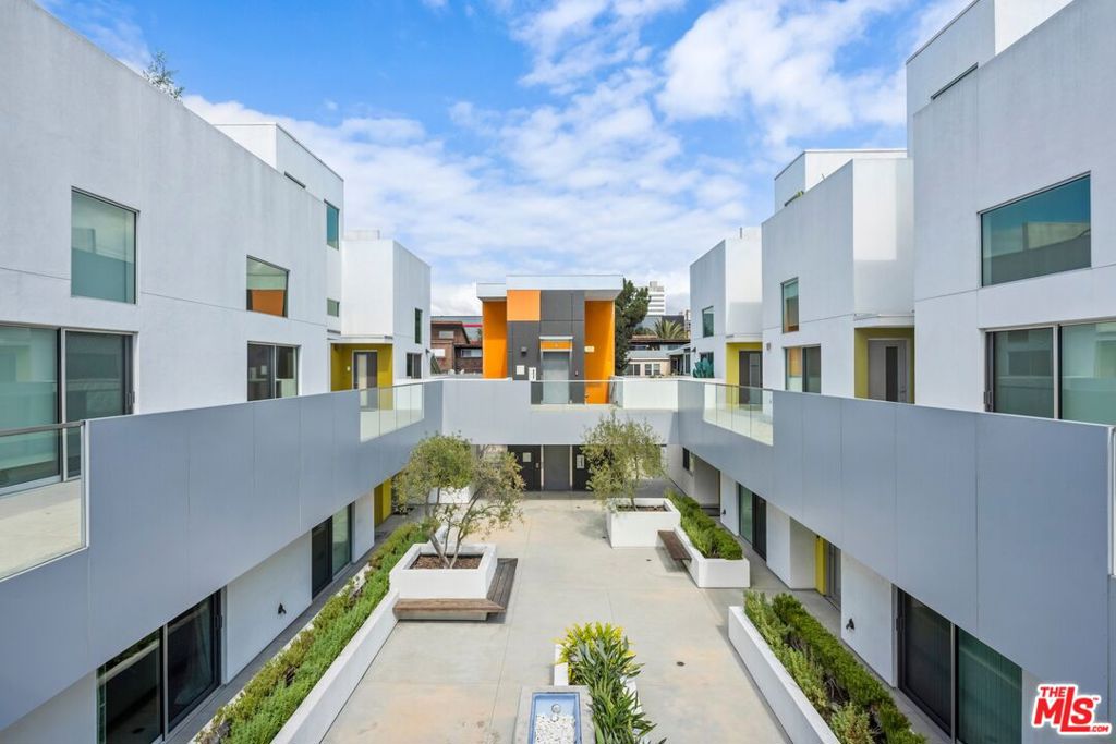 Set in a gated boutique building just moments from the best of Santa Monica, this thoughtfully designed corner-unit 2 bed, 2 bath home blends contemporary comfort with coastal ease. A sun-filled open floor plan with wide windows and high ceilings creates an airy living space that flows seamlessly into the dining area and kitchen, outfitted with premium Viking and Bosch appliances, and opens to a desirable private outdoor space with a backyard and patioperfect for relaxing or entertaining. The primary suite offers generous closet space and a private bath, while the second bedroom is ideal for guests, a home office, or creative studio. Additional features include in-unit laundry, secure side-by-side parking with extra storage in the gated garage, and an enviable location close to Montana Avenue cafs, world-class dining, and the iconic Santa Monica coastline. HOA is $580 and covers trash, community utilities and landscaping, as well as gas.