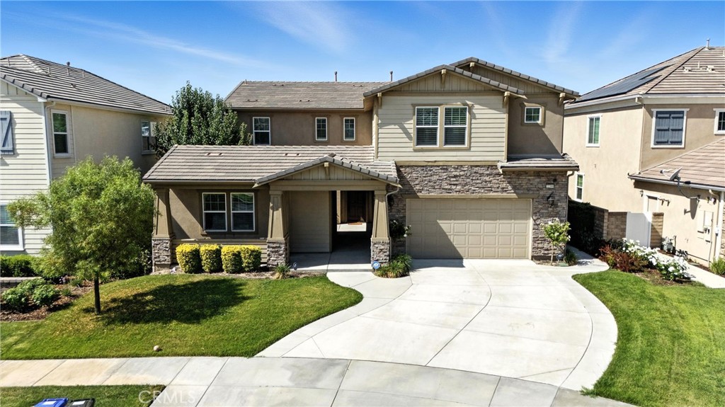 Elegant Executive Estate nestled on a private cul-de-sac in the exclusive gated River Village community. This sophisticated residence offers the perfect blend of comfort, design, and functionality—with a main home featuring 4 spacious bedrooms and 4 designer bathrooms, plus a separate, private casita with its own bedroom and bathroom—ideal for guest accommodations, in-laws, or a luxury office retreat. Must check out the bonus rooms, can be used as office or gym.
The grand primary suite is a sanctuary unto itself, showcasing breathtaking mountain views, a generous walk-in closet for his and hers, and a spa-style bath with a soaking tub, oversized walk-in shower, and dual vanities.
Upon entry, you’re welcomed by a dramatic curved staircase beneath a statement chandelier, leading to a formal dining room perfect for elegant entertaining. The gourmet chef’s kitchen is a true showpiece—outfitted with premium built-in stainless steel appliances, granite countertops, a substantial center island, and an expansive walk-in pantry. The open-concept design flows seamlessly into the family room with a warm fireplace, creating an ideal setting for everyday luxury living.
Additional highlights include a dedicated office/bonus room and a fully equipped home theater/media room complete with soundproofing, custom seating, a projector screen, surround sound.
Enjoy indoor-outdoor living with a covered patio perfect for al fresco dining and entertaining. The home is equipped with owned solar(paid), tankless water heater, a 3-car garage with and other premium upgrades focused on sustainability and efficiency. Includes ADT security alarm(paid).
Ideally located with quick access to both the 5 and 14 freeways via Newhall Ranch and Golden Valley Road, and just minutes from upscale dining, scenic hiking trails, parks, and top-rated schools.