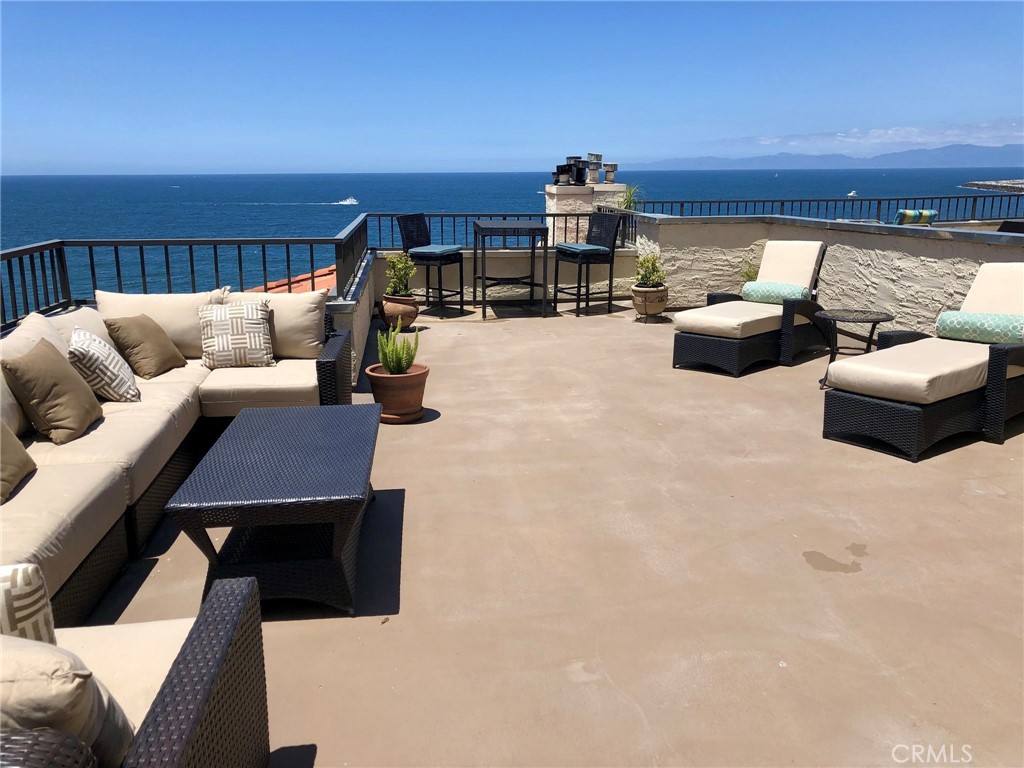 A perfect executive rental with an expansive private patio. Panoramic ocean views from Palos Verdes to Point Dume with wrap around deck, fire pit and gas grill—perfect for your next cocktail party. Sub Zero refrigerator, gas fireplace, wood floors, Bose sound system, remote controlled window shades, Rainfall and handheld showers, and oversized tub. The 3rd bedroom is currently being used as an office. Fully furnished (although some furniture can be negotiated) including dishes, cookware, and small appliances. Two secured, non-tandem parking spaces located on the main parking level directly next to the main lobby and elevators. Private access to the beach between Topaz Avenue and Ruby Avenue. A 5 minute Walk to the pier or the village for restaurants, shopping, entertainment, whale watching, the Beach Life Festival and the farmers market on Thursday mornings. All things aquatic within a stone’s throw. A truly unique property. A very unique opportunity!