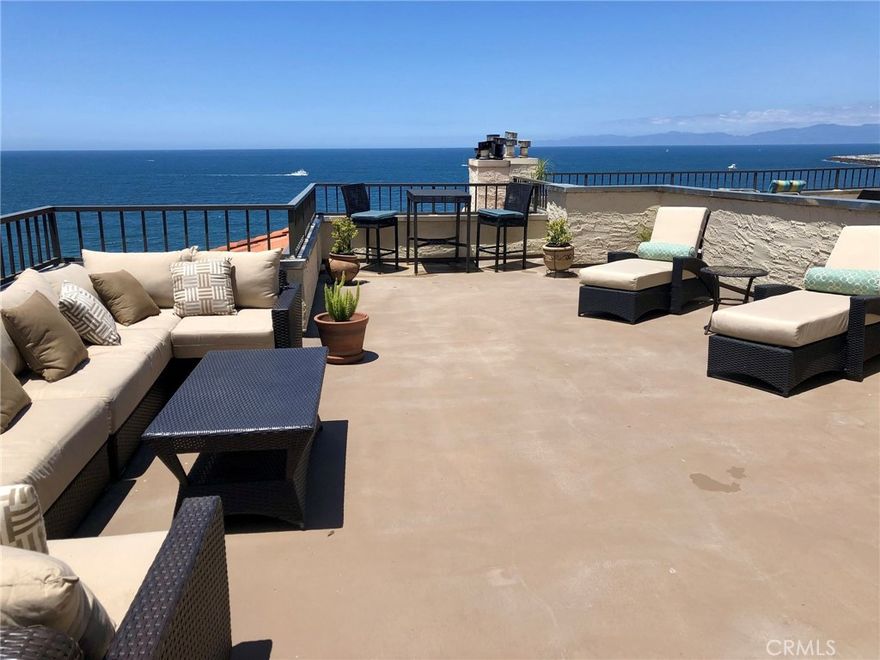 A perfect executive rental with an expansive private patio. Panoramic ocean views from Palos Verdes to Point Dume with wrap around deck, fire pit and gas grill—perfect for your next cocktail party. Sub Zero refrigerator, gas fireplace, wood floors, Bose sound system, remote controlled window shades, Rainfall and handheld showers, and oversized tub. The 3rd bedroom is currently being used as an office.  Fully furnished (although some furniture can be negotiated) including dishes, cookware, and small appliances. Two secured, non-tandem parking spaces located on the main parking level directly next to the main lobby and elevators. Private access to the beach between Topaz Avenue and Ruby Avenue. A 5 minute Walk to the pier or the village for restaurants, shopping, entertainment, whale watching, the Beach Life Festival and the farmers market on Thursday mornings.  All things aquatic within a stone’s throw.  A truly unique property. A very unique opportunity!
