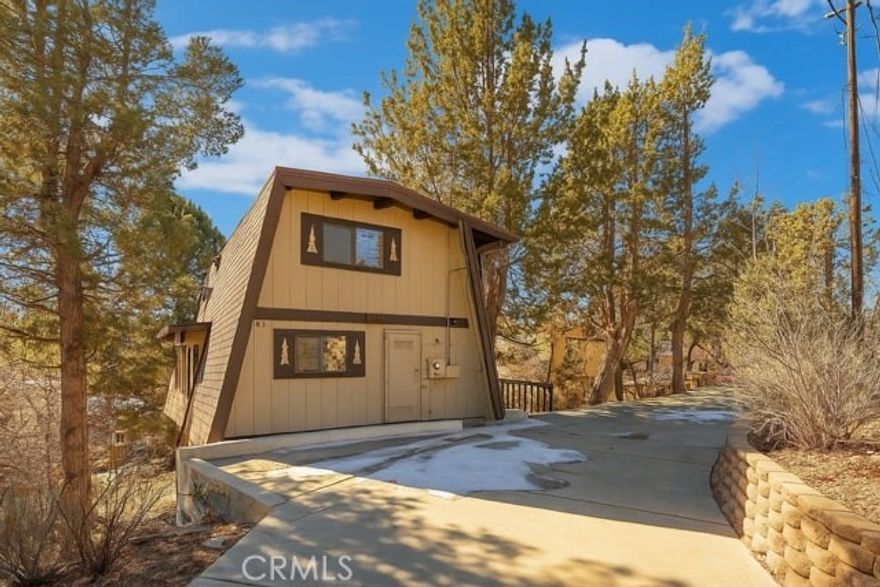 Located in Whispering Forest, this beautifully maintained 4-bed, 2.5-bath home offers serene mountain views and 1,636 sq. ft. of inviting living space. Features include open beam ceilings, wood paneling, a stone fireplace, and a spacious slider that fills the home with natural light. The wraparound multi-level deck is perfect for outdoor entertaining, along with a private spa, mature trees, and a storage shed. Currently a successful Airbnb and offered furnished, it’s an ideal retreat or income property.